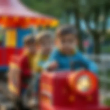 Children enjoying a ride on a lunapark train, emphasizing development.